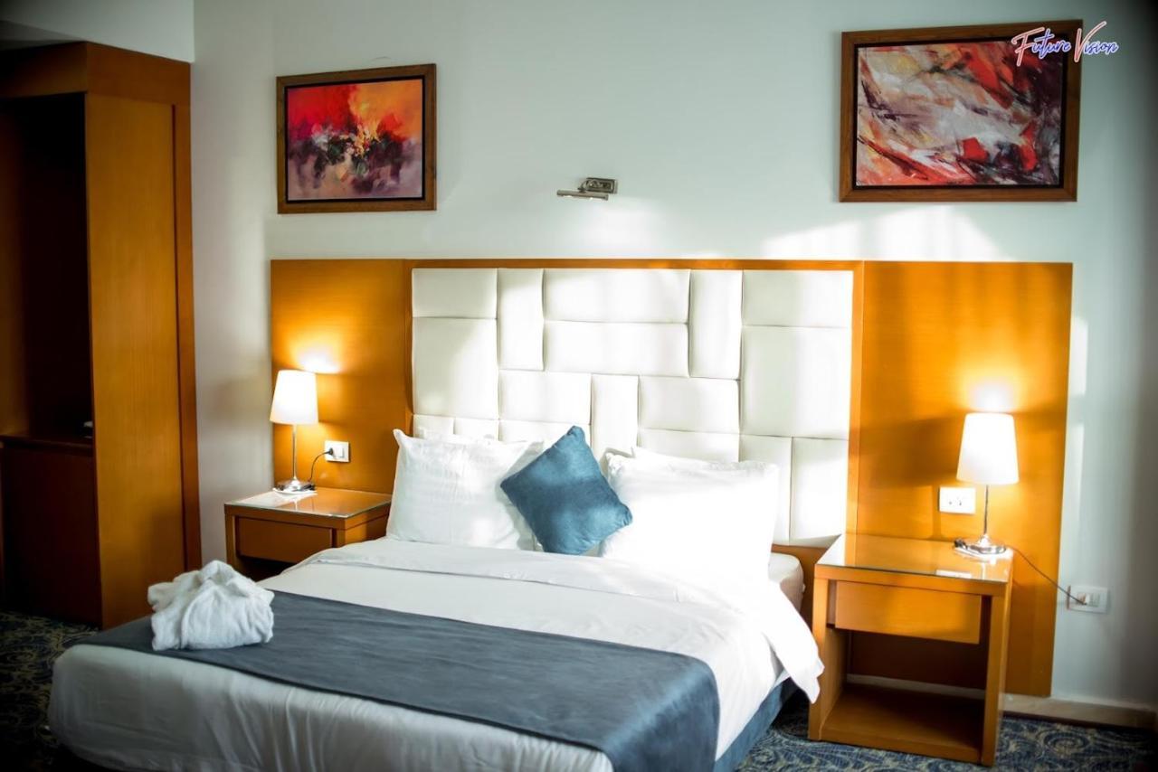 Rehana Plaza Hotel Kairo Bagian luar foto A bedroom at the hotel